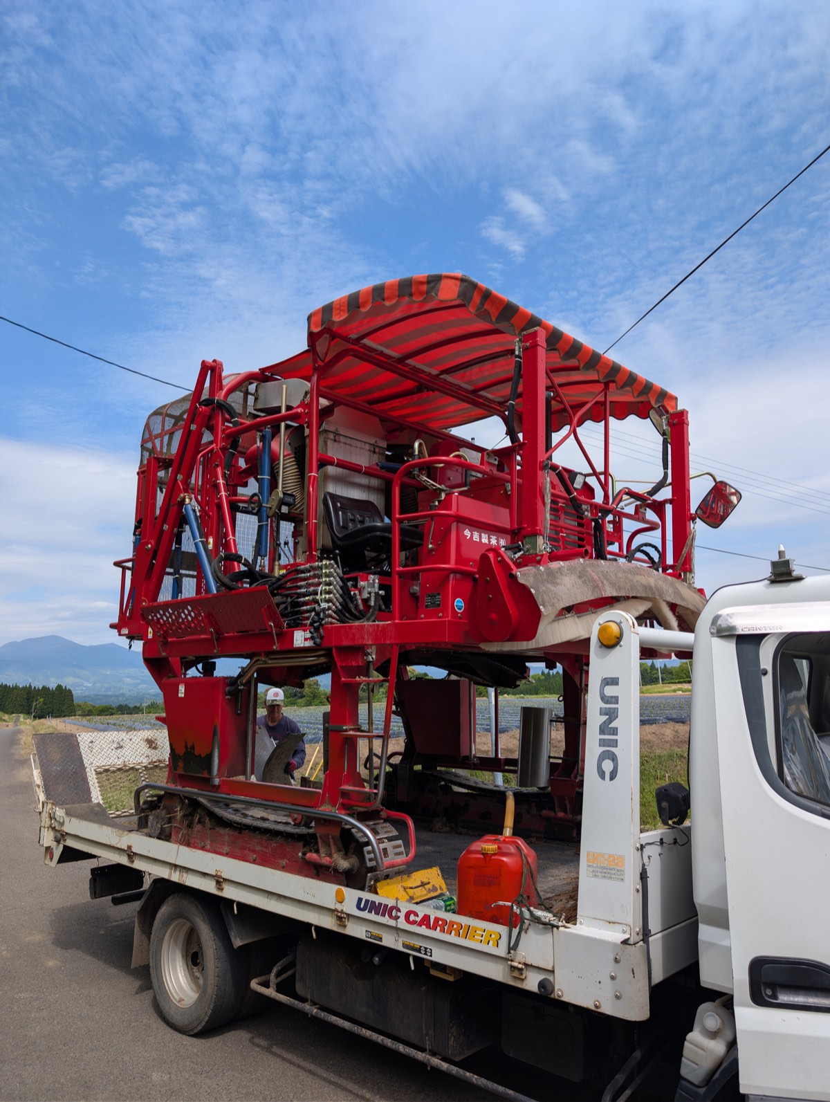 The red tea harvester under a blue sky